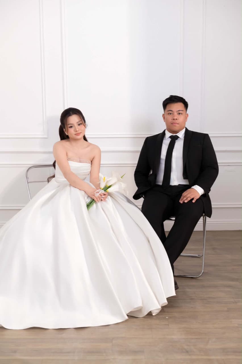 Paul and Maria seated together in the studio